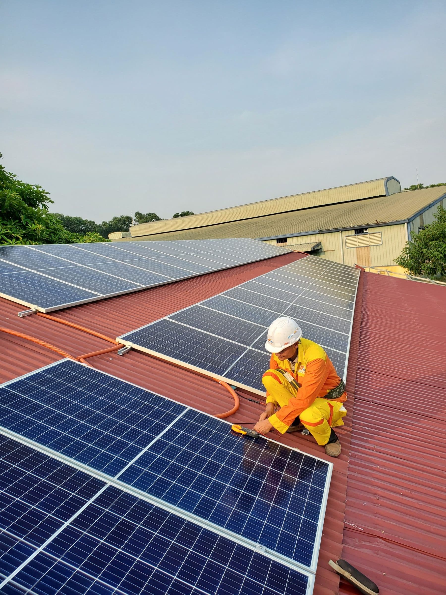 Solar panel installation on an industrial rooftop